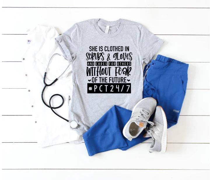 She Is Clothed in Strength and Dignity Nurse Tee